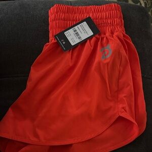 Peloton Women's Athletic Shorts in Bold Orange